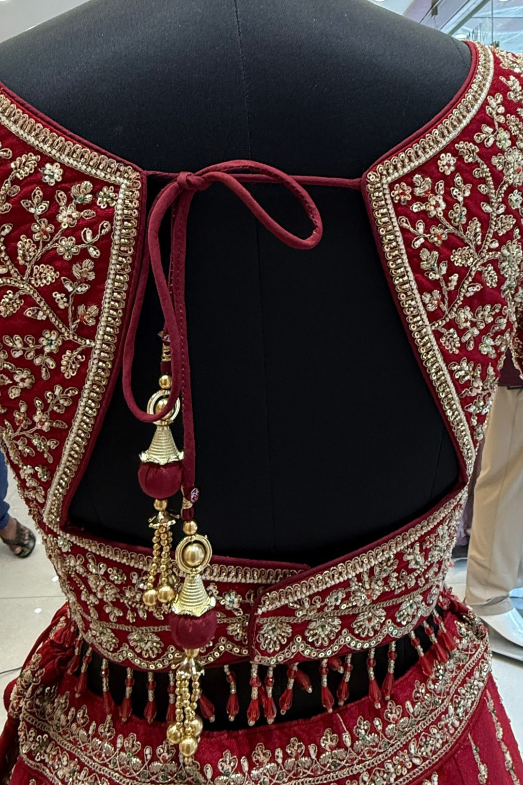 Red Beads, Sequins and Zari work Bridal Lehenga with Intricate Peacock and Elephant Motifs