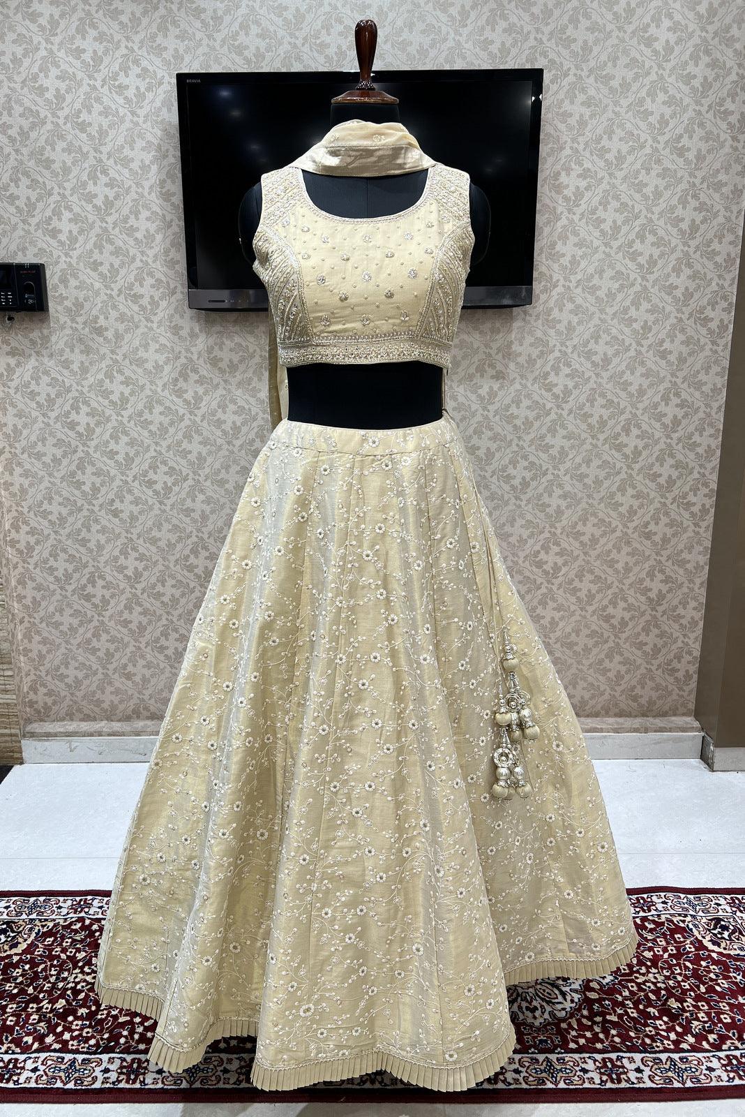 LIGHT GOLD CLASSIC BRIDAL LEHENGA SET WITH ALL OVER PATTERNED HAND  EMBROIDERY PAIRED WITH A MATCHING DUPATTA AND GOLD MIRROR DETAILS. -  Seasons India