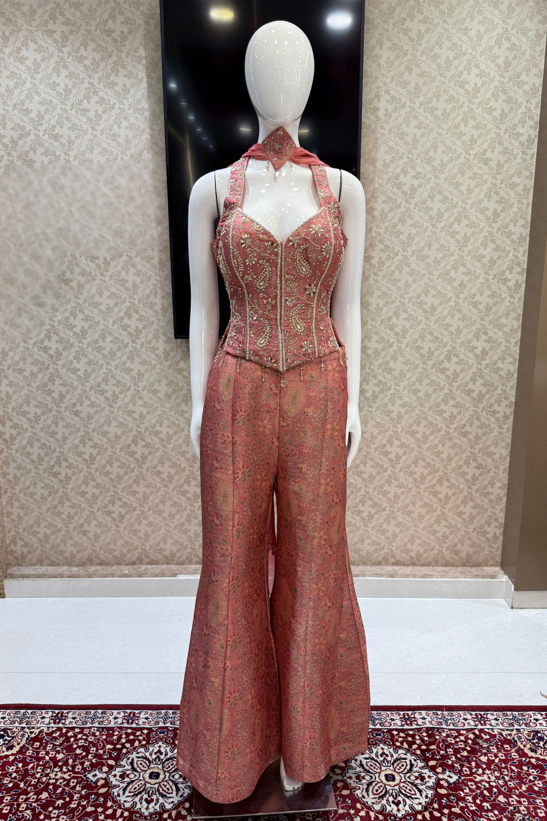 Peach Halter Neck Palazzo Salwar Suit with Multicolor Brocade and Sequins Detailing