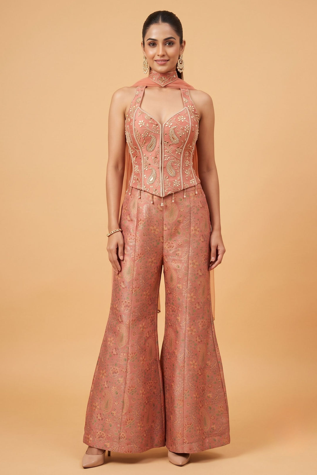 Peach Halter Neck Palazzo Salwar Suit with Multicolor Brocade and Sequins Detailing