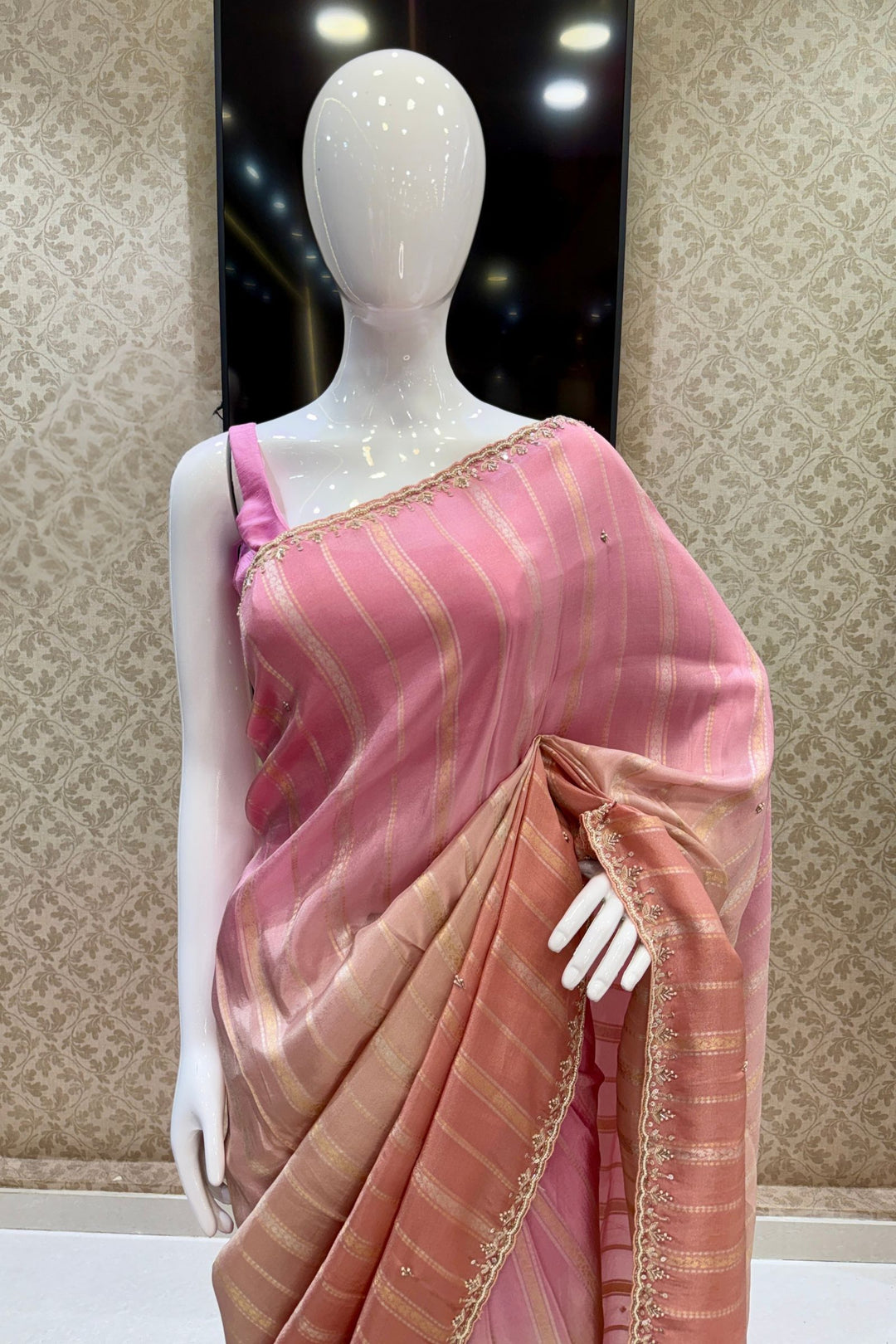 Elegant Pink and Peach Saree with Golden Zari Stripe Detailing