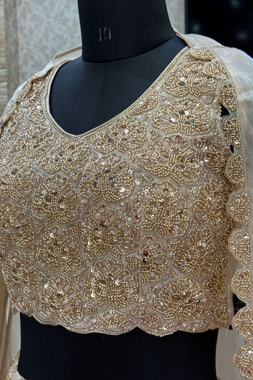Gold Sequins and Beads work Choli with Lehenga and Draped Cape