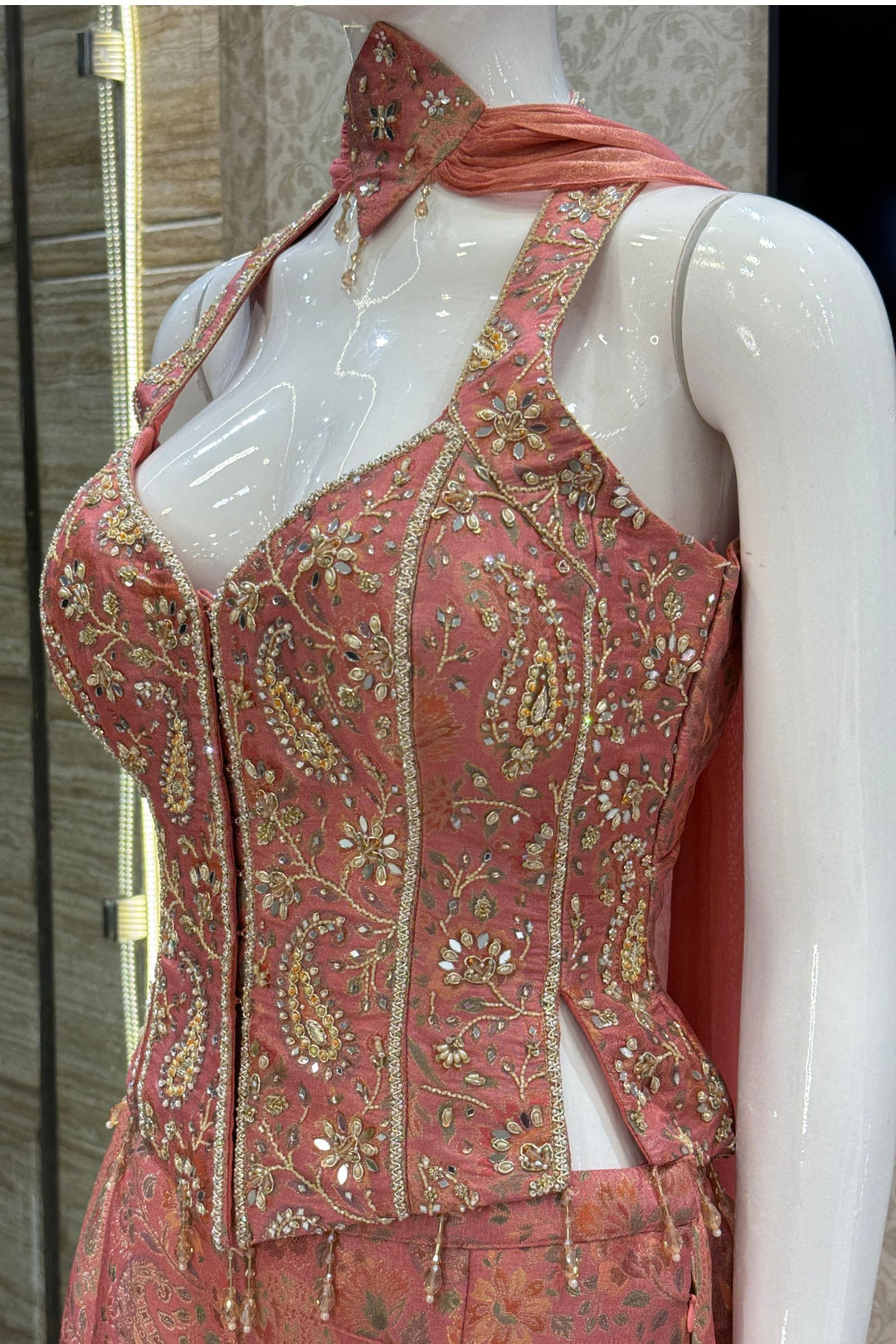 Peach Halter Neck Palazzo Salwar Suit with Multicolor Brocade and Sequins Detailing