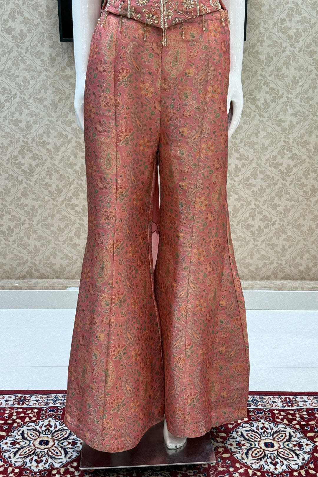 Peach Halter Neck Palazzo Salwar Suit with Multicolor Brocade and Sequins Detailing