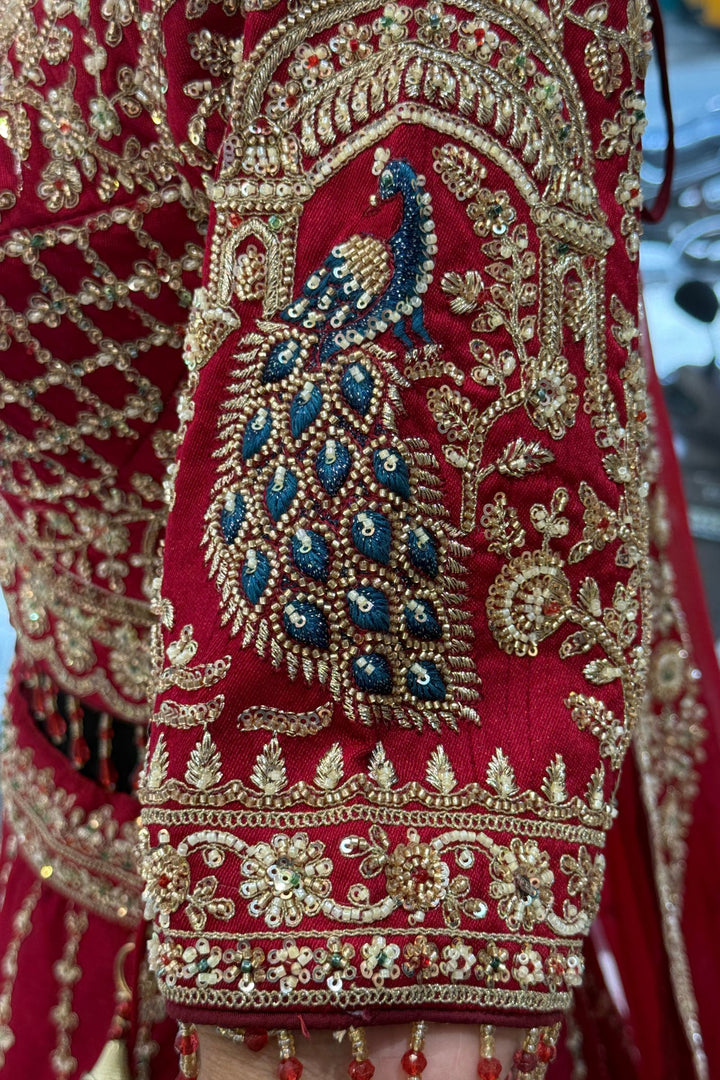 Red Beads, Sequins and Zari work Bridal Lehenga with Intricate Peacock and Elephant Motifs