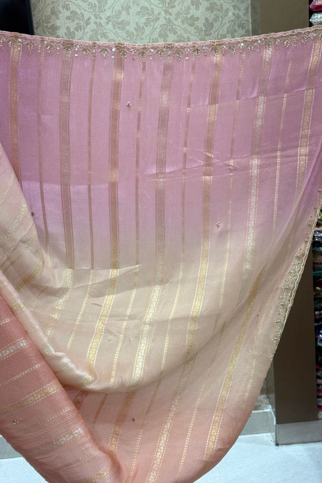 Elegant Pink and Peach Saree with Golden Zari Stripe Detailing