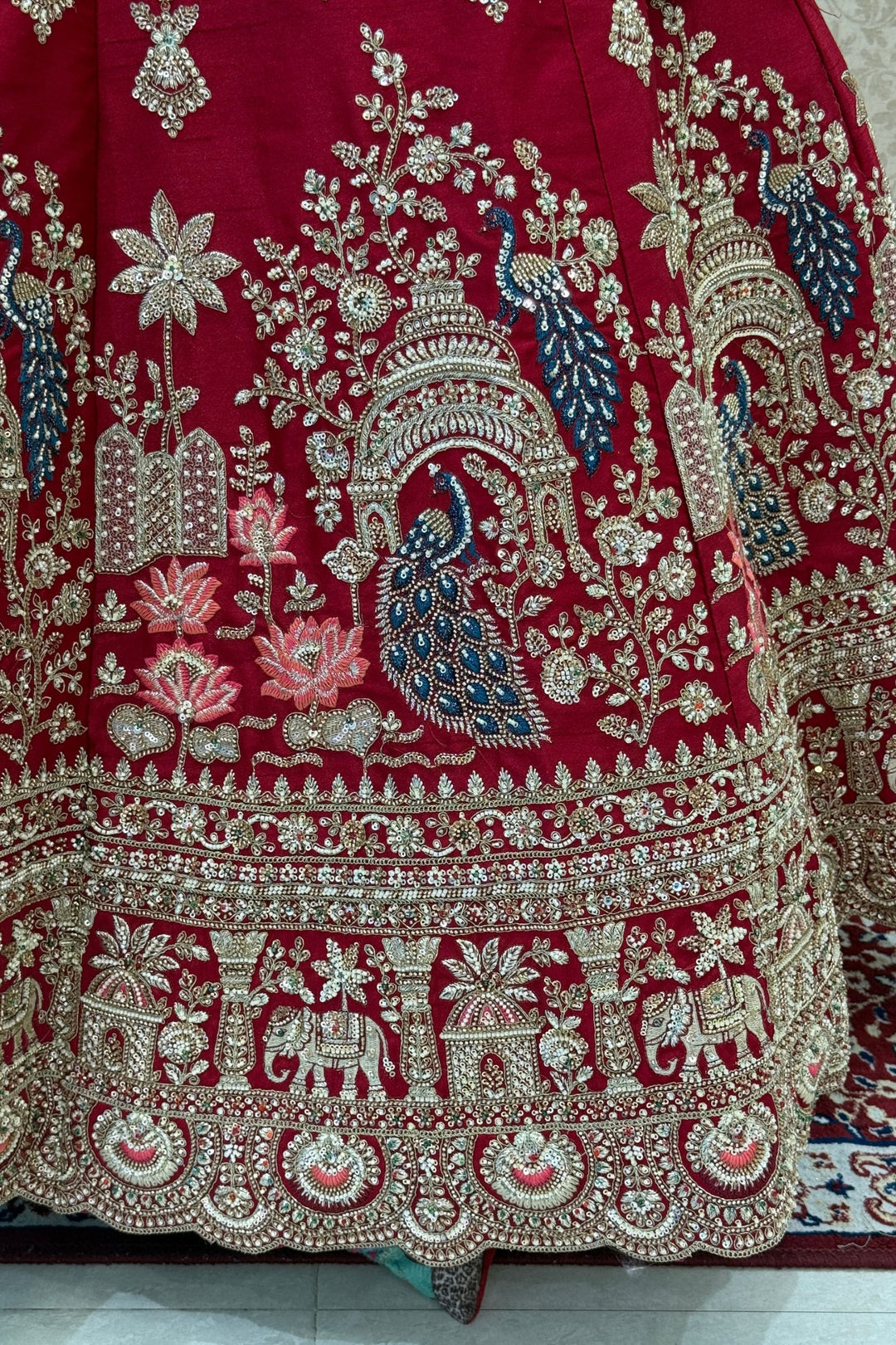 Red Beads, Sequins and Zari work Bridal Lehenga with Intricate Peacock and Elephant Motifs