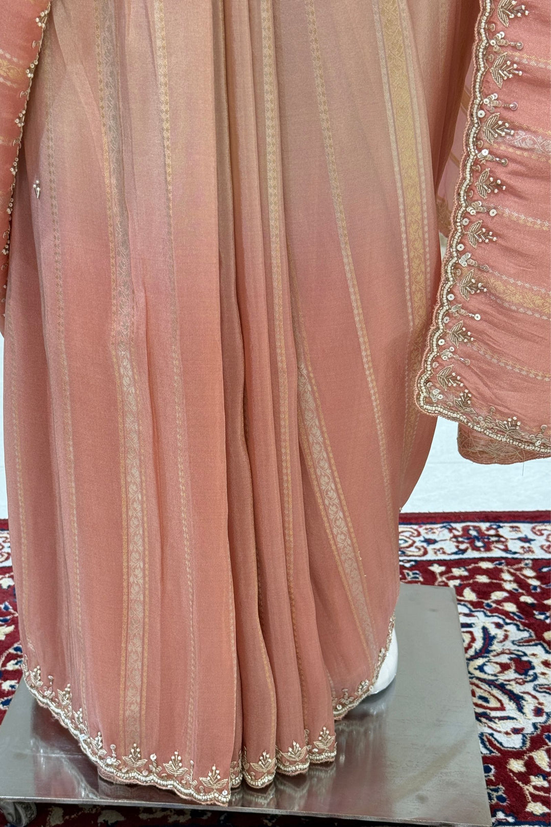 Elegant Pink and Peach Saree with Golden Zari Stripe Detailing