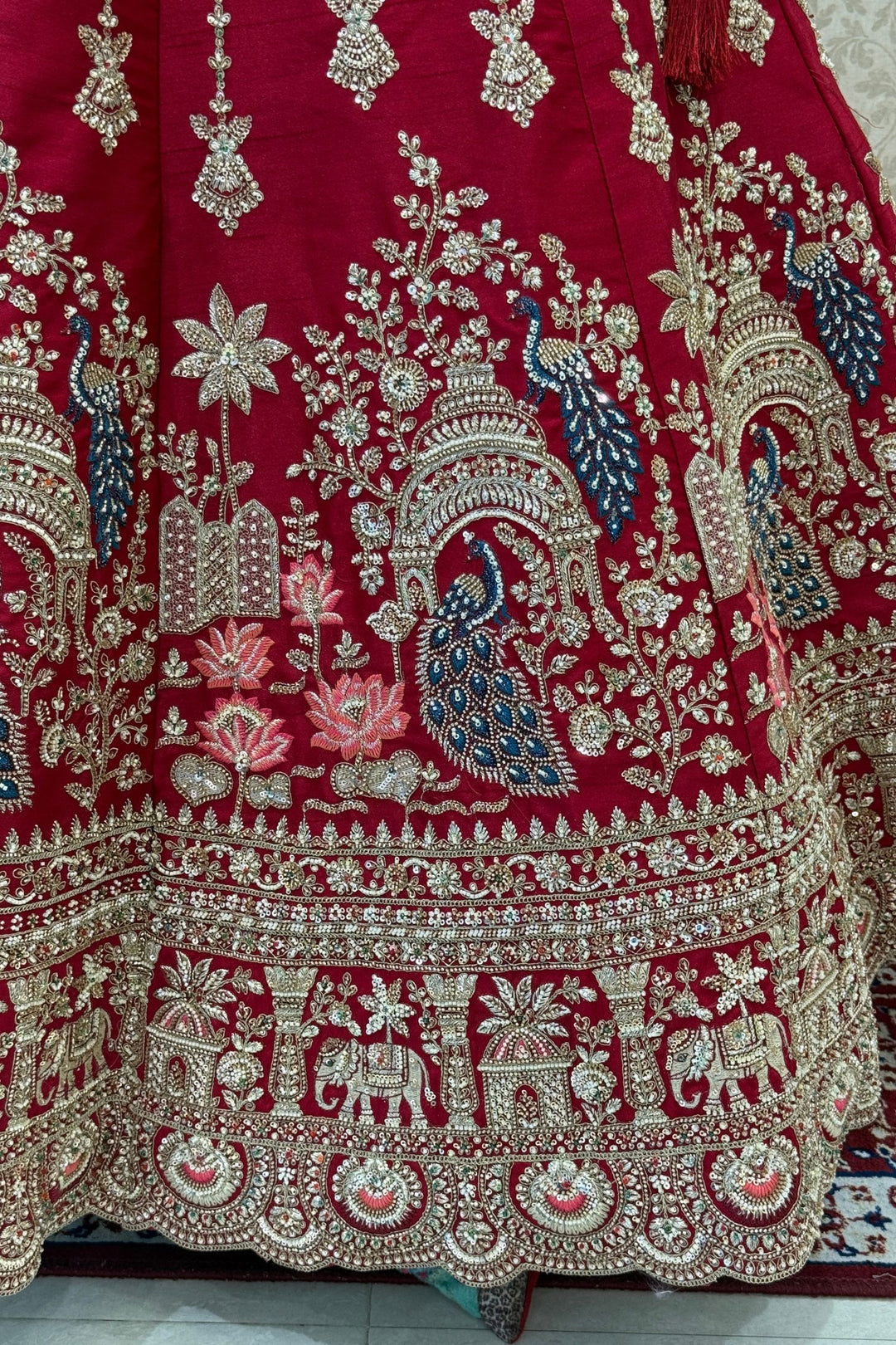 Red Beads, Sequins and Zari work Bridal Lehenga with Intricate Peacock and Elephant Motifs