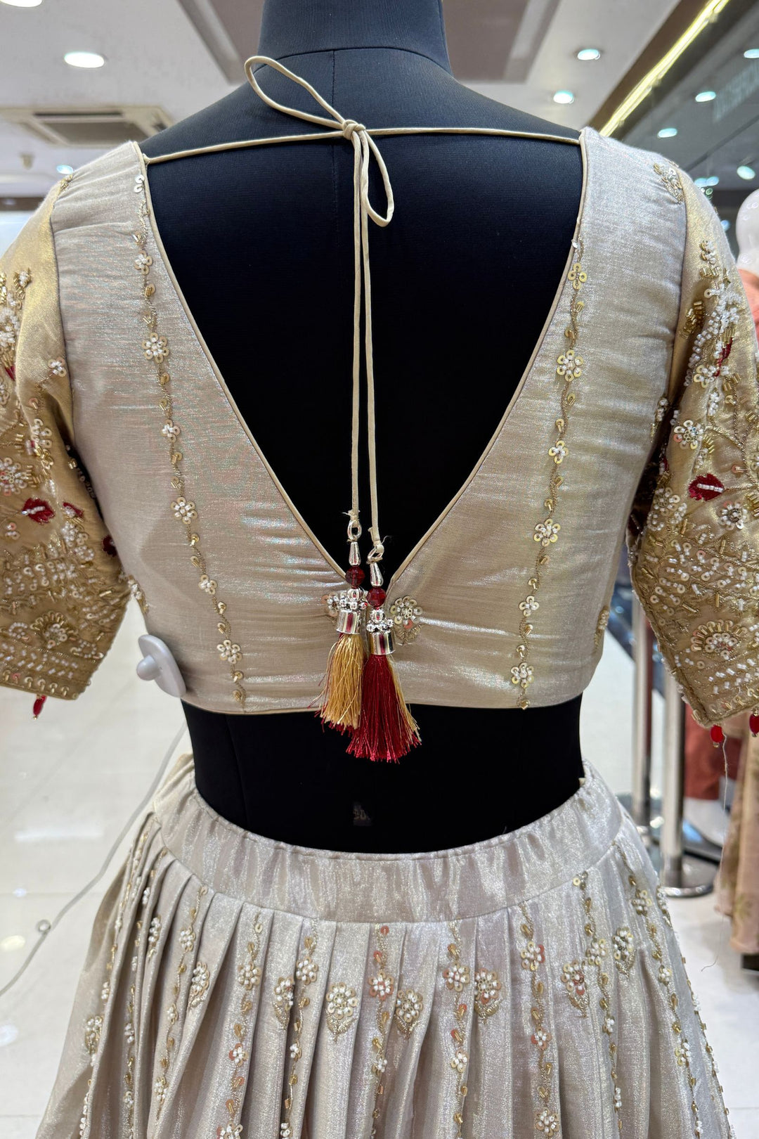 Beige and Gold Embellished Lehenga Set with Contrast Maroon Dupatta