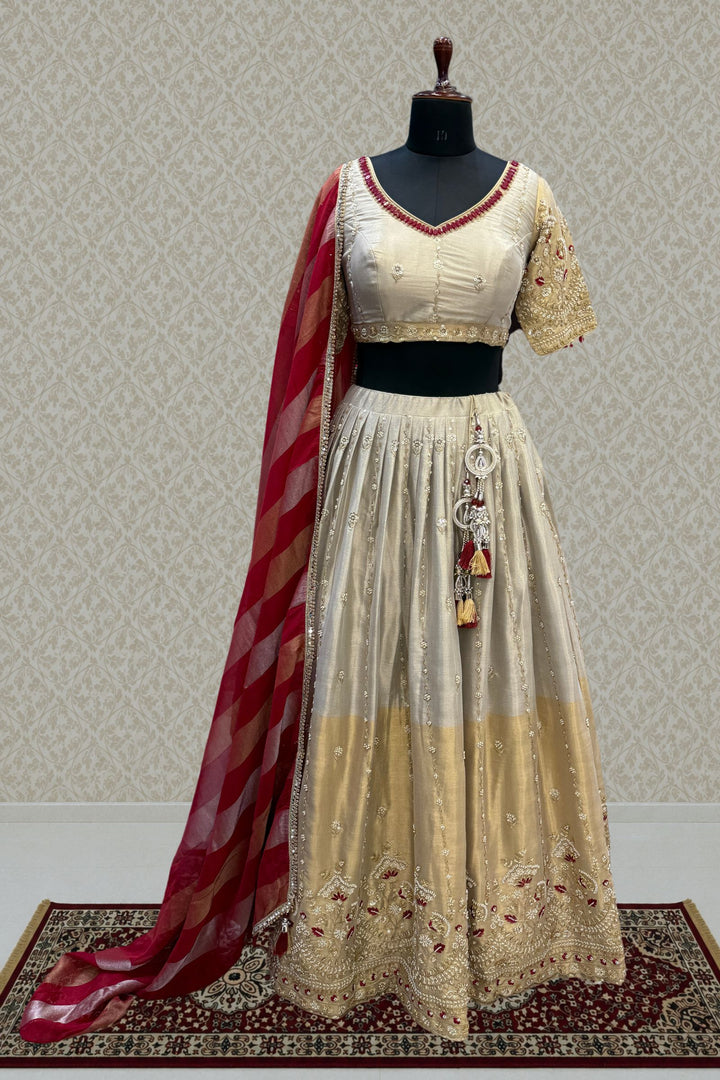 Beige and Gold Embellished Lehenga Set with Contrast Maroon Dupatta