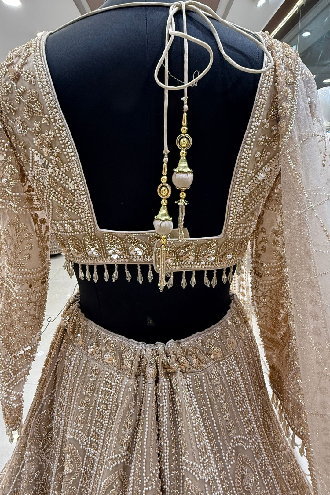 Beige Sequins, Pearl and Zari work Flared Lehenga Set with Peacock Motifs