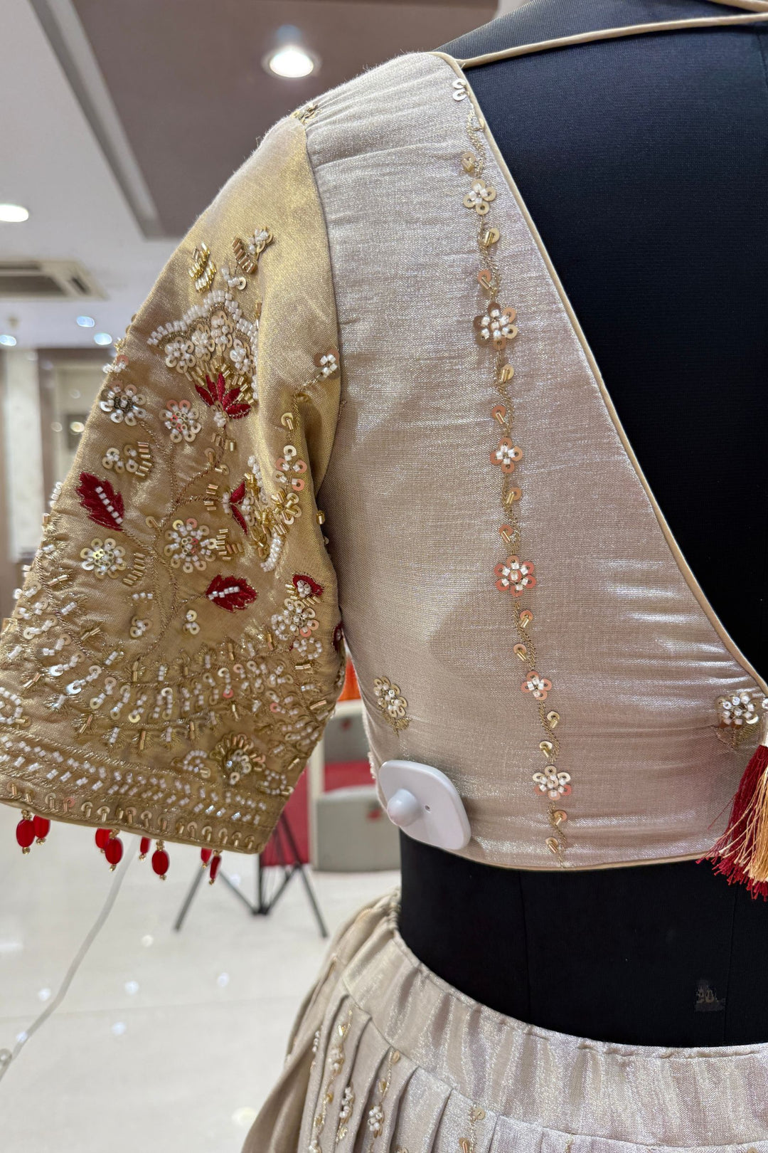 Beige and Gold Embellished Lehenga Set with Contrast Maroon Dupatta